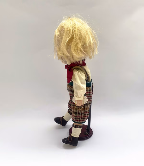 Sculpture: Otto left side Hacked doll with soft body and china hands and feet. Doll face is replaced with uncanny head made from textile.