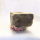 Soft sculpture head crushed by a brick