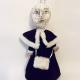 Hacked doll with a Kilner jar clip around its 'ugly' uncanny head.