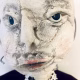 Hacked doll with a Kilner jar clip around its 'ugly' uncanny head.