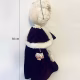 Hacked doll with a Kilner jar clip around its 'ugly' uncanny head.