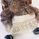 Doll with decayed silk dress.