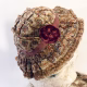 Hacked doll with decayed silk dress. The original ‘pretty’ head is replaced with an oversized, bald, uncanny head.