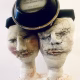 Double headed skeletal torso sculpture crowned with a vintage mechanical hubodometer