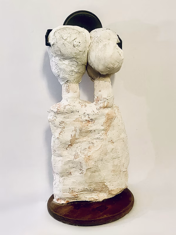 Double headed skeletal torso sculpture crowned with a vintage mechanical hubodometer