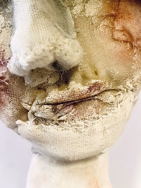 Skeletal torso sculpture face detail