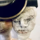 Double headed skeletal torso sculpture crowned with a vintage mechanical hubodometer