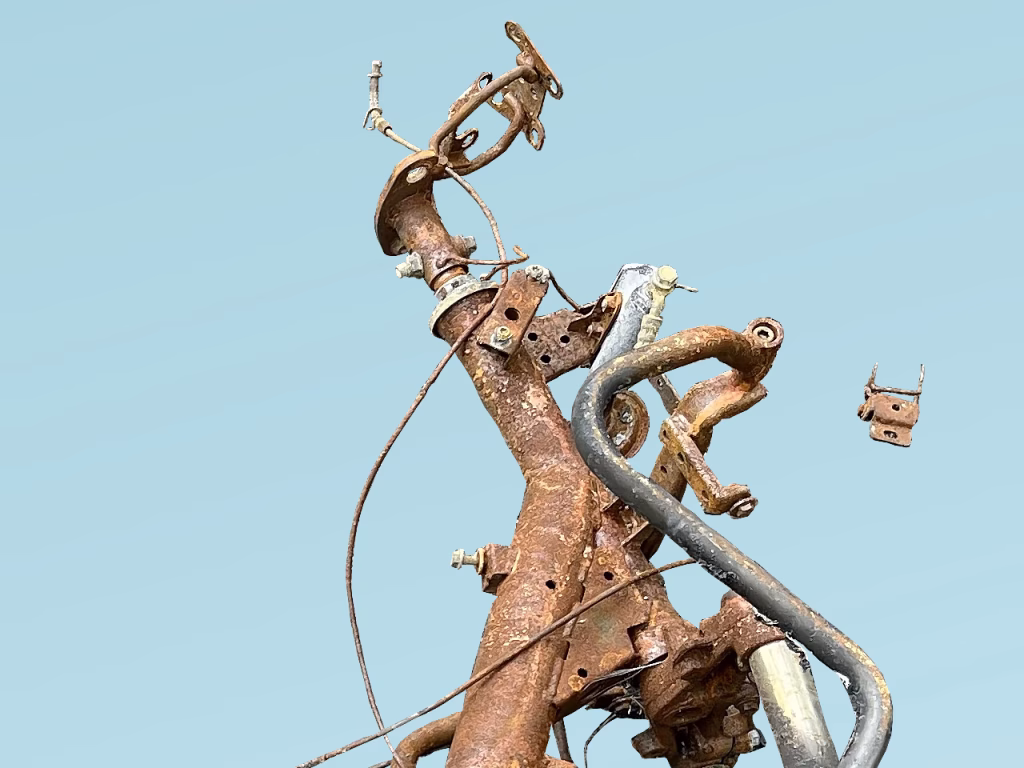 Partial image of a torched motorbike on blue background