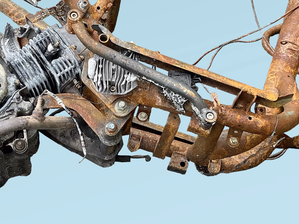 Partial image of a torched motorbike on blue background