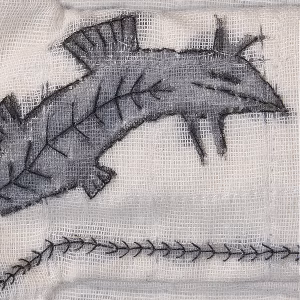 A muslin type of textile with a fish