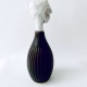 Small sculpture head emerging from ceramic pot