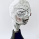 Small sculpture head emerging from ceramic pot