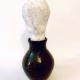 Small sculpture head emerging from ceramic pot